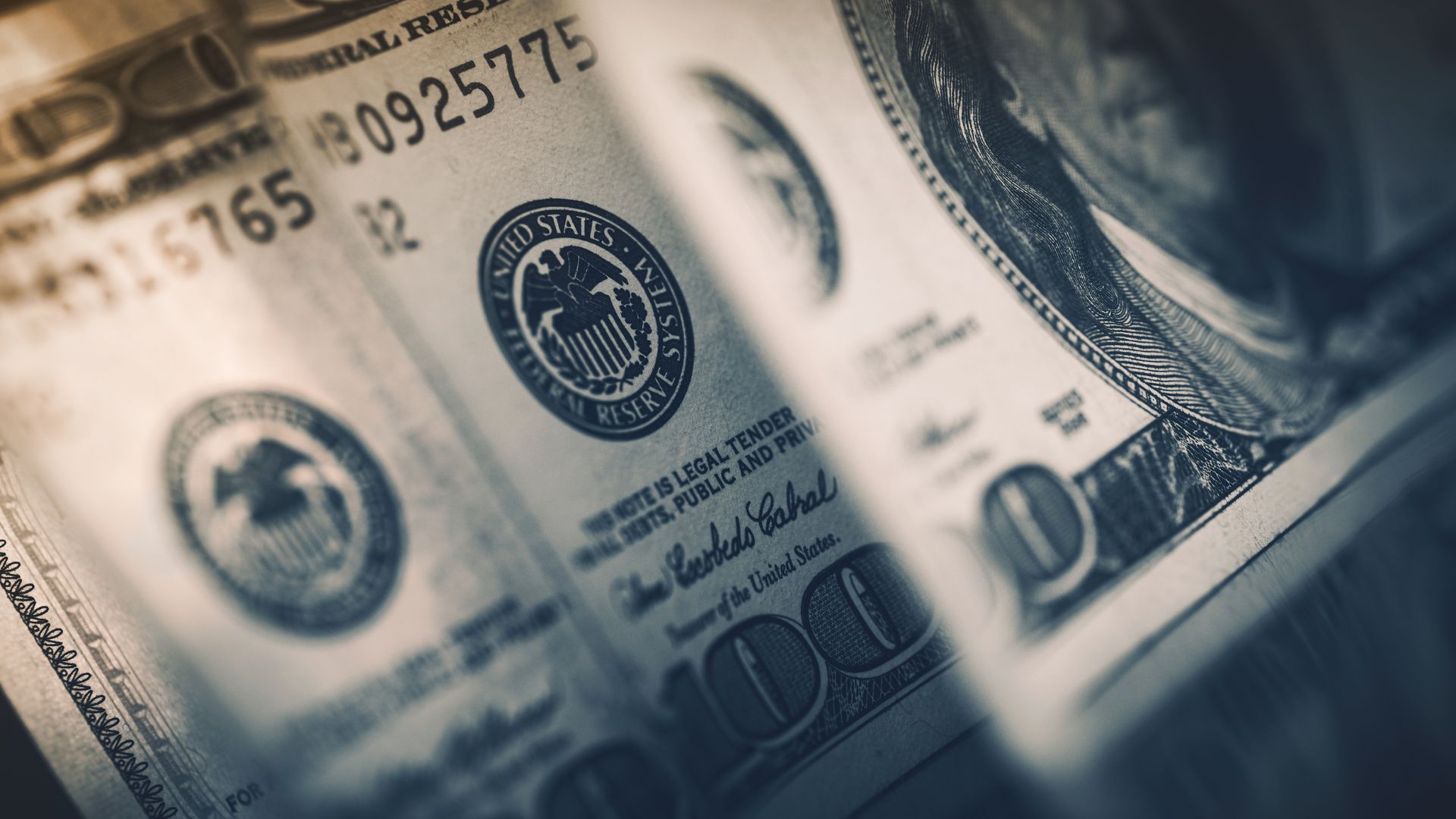 Bonus Dividend A close-up of $100 bill