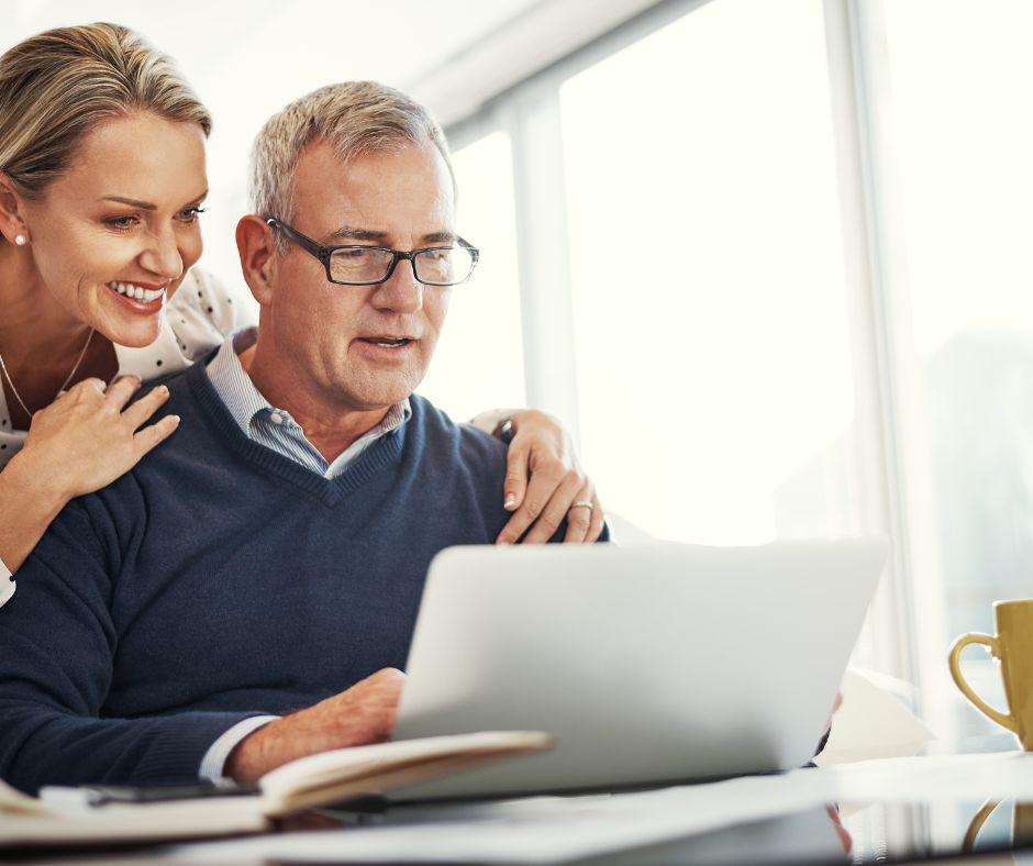 Man and a woman working on a laptop