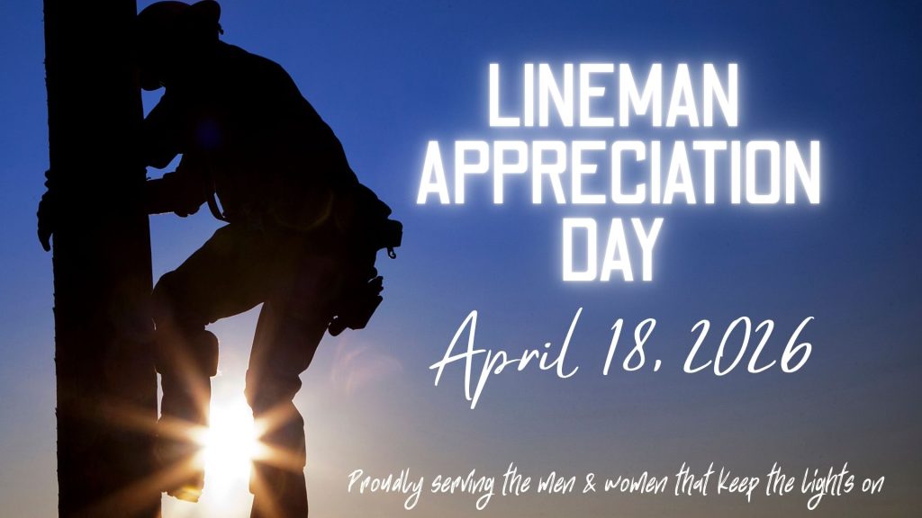 A lineman on a pole with a reminder of Lineman Appreciation Day